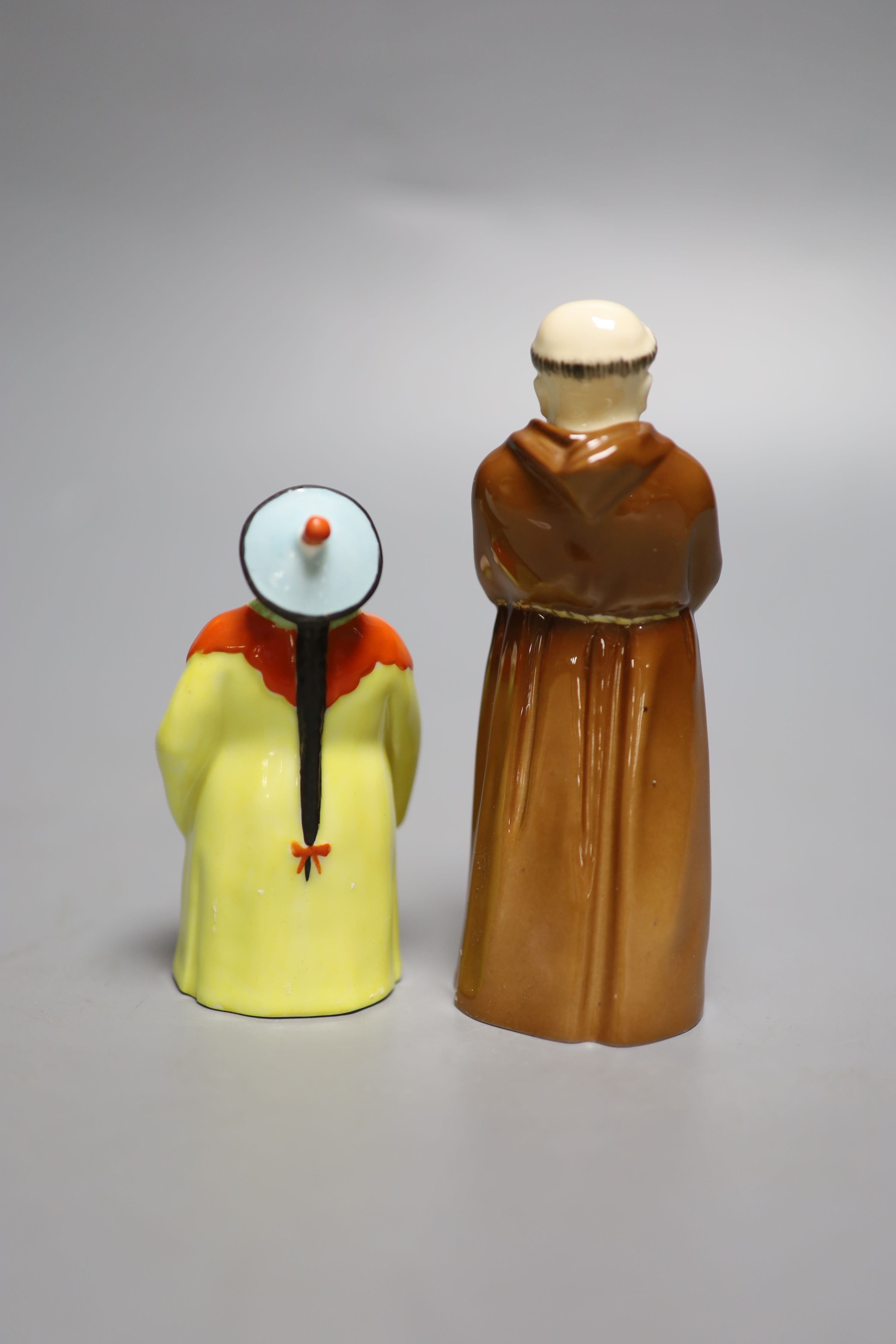 A Royal Worcester candlesnuffer of the Mandarin, date mark 1930 and black mark, and The Monk